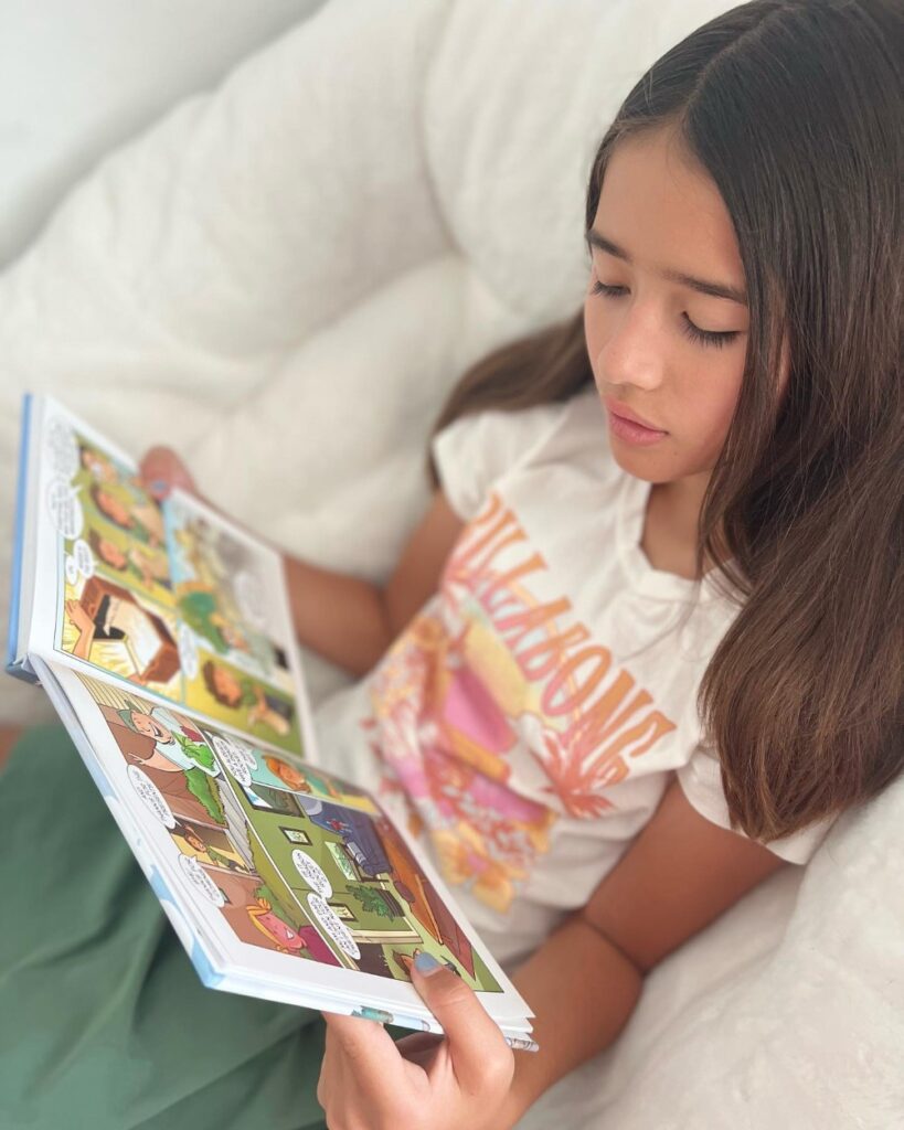 Child reading the Golden Quest